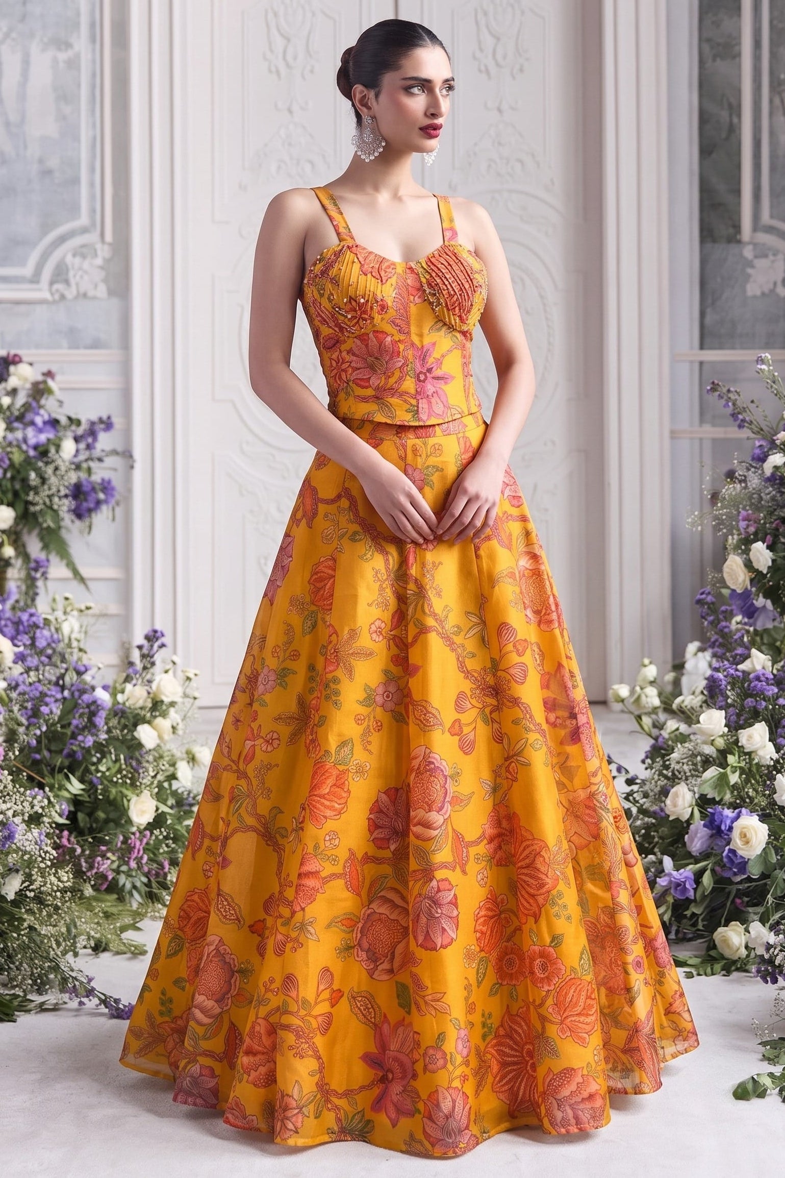 Mustard yellow party wear lehenga with a sweetheart blouse and floral organza skirt.