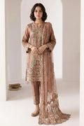 Standing model in a light brown indian kurta for women with delicate thread embroidery, straight pant with embroidered hem and sheer net dupatta.