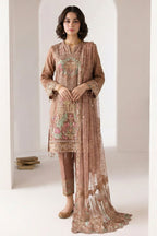 Standing model in a light brown indian kurta for women with delicate thread embroidery, straight pant with embroidered hem and sheer net dupatta.