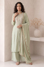 Full-length front view of pastel mint green women kurta set, an A-line kurta with ankle-length pants and embroidered yoke in roman silk.