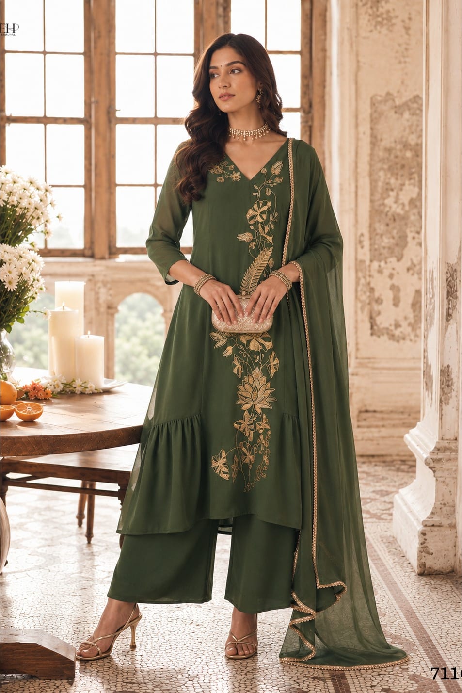Full-length front view of olive green festive wear for women, an A-line pleated kurta with pant, gold zari and sequin work and net dupatta.