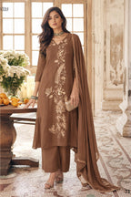 Full-length front view of brown festive wear for women, an A-line pleated kurta with pant, gold zari and sequin work and net dupatta.