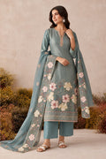 Woman wearing a greyish blue embroidered kurta sets for women outfit in shimmer silk with floral thread work and chiffon dupatta, front view.