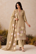 Woman wearing a camel beige kurta set in shimmer silk with floral thread embroidery, santoon pant and chiffon dupatta, full-length front view.
