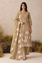 Woman wearing a camel beige kurta set for women in shimmer silk with floral thread embroidery and chiffon dupatta, full-length front view.