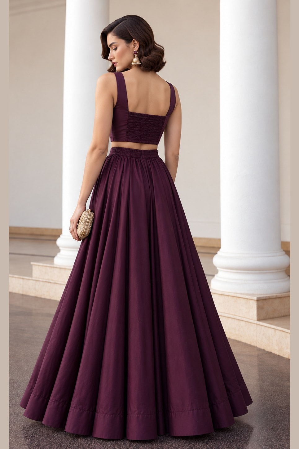 Full back view of the Burgundy sequins lehenga, showing the square back neckline of the sleeveless choli and flowing soft silk lehenga.