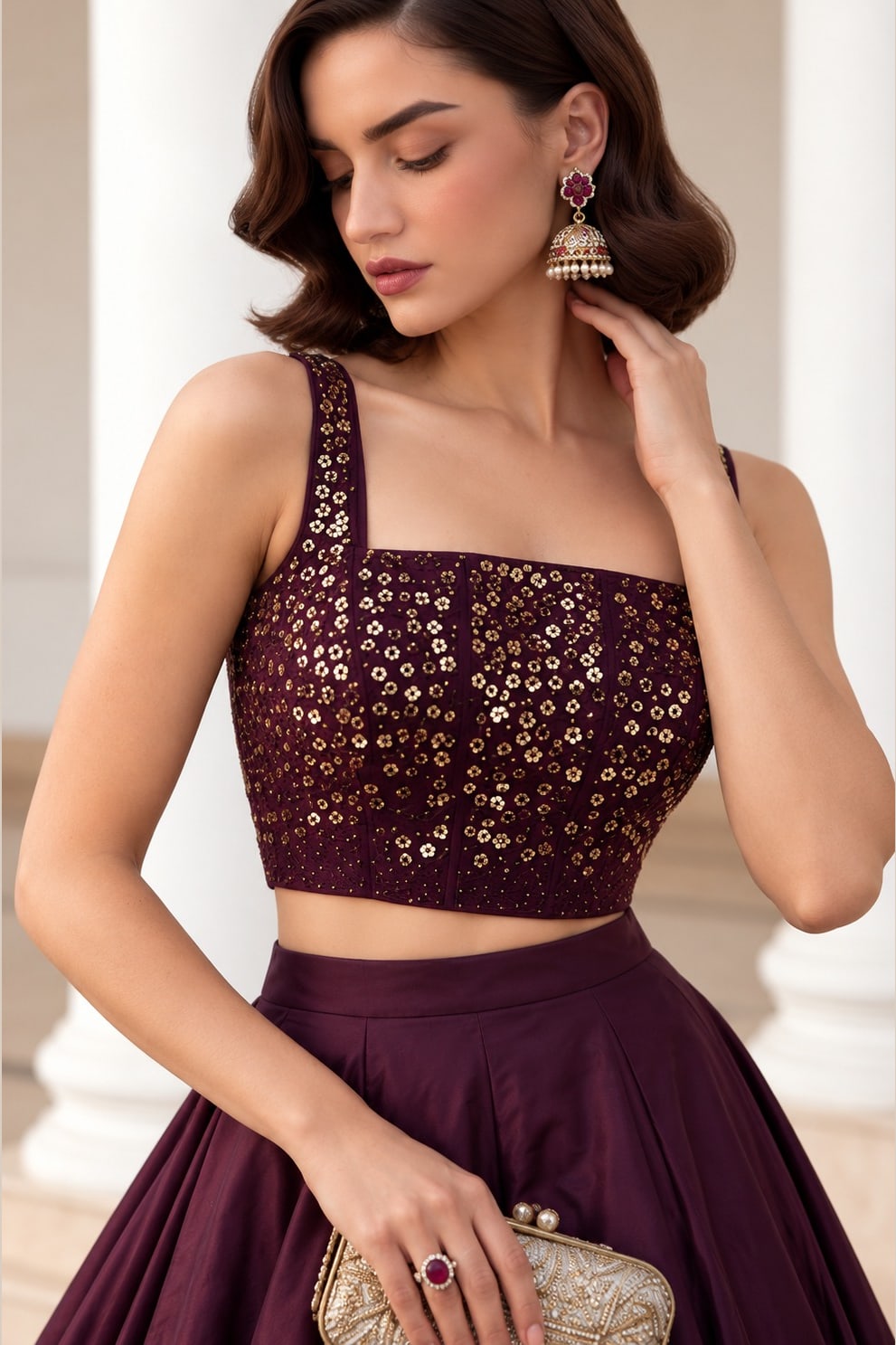 Close-up of the Burgundy embroidered lehenga, showing the sequins embroidery detailing on the soft silk choli neckline.