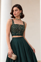 Front view of the Dark Green lehenga choli designs, displaying the flared soft silk lehenga skirt and embroidered sleeveless choli.