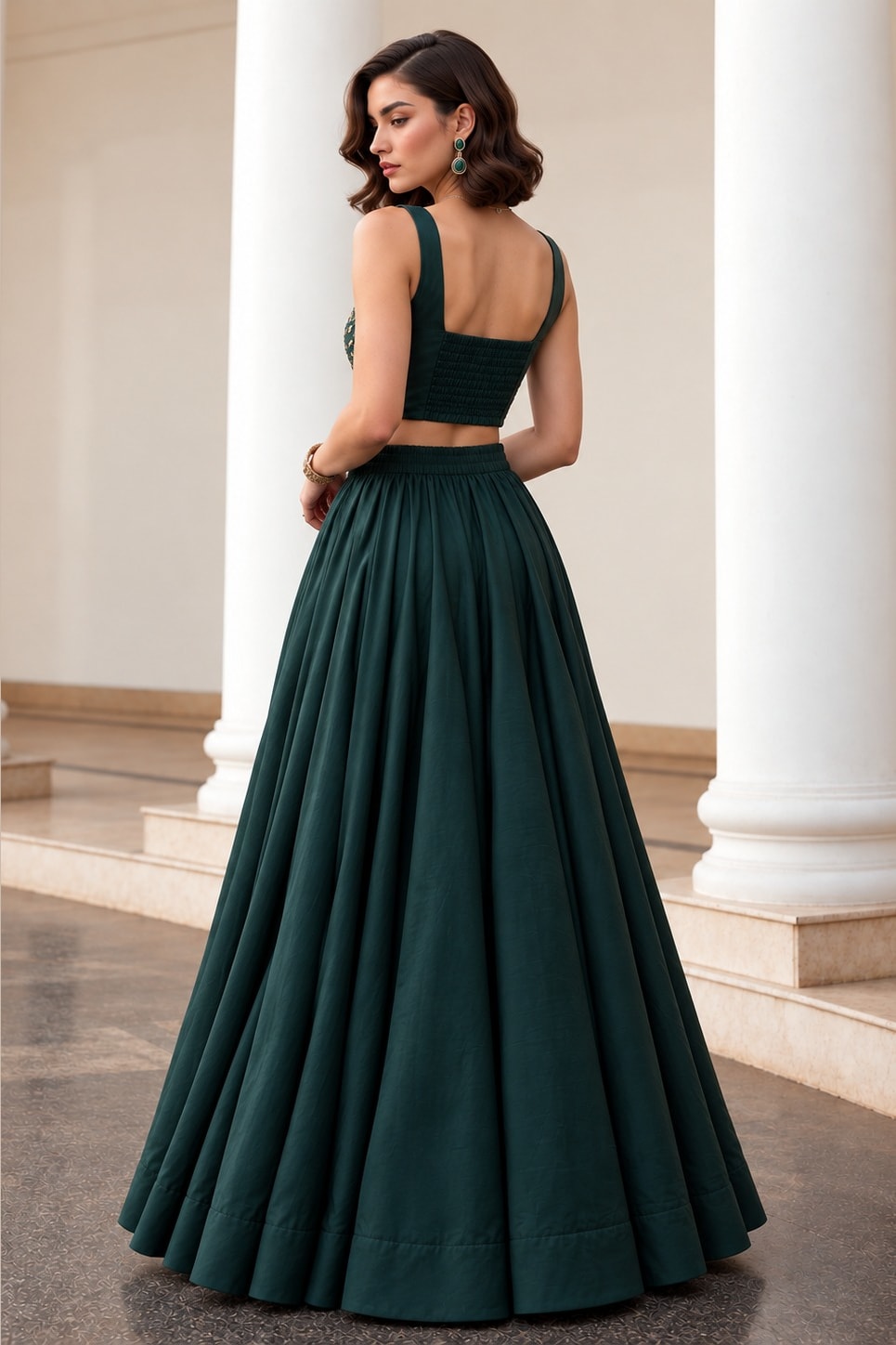 Full back view of the Dark Green wedding lehenga, showing the square back neckline of the sleeveless choli and flowing soft silk lehenga.