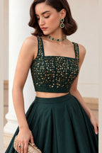 Close-up of the Dark Green lehenga skirt, showing the sequins embroidery detailing on the soft silk choli neckline.