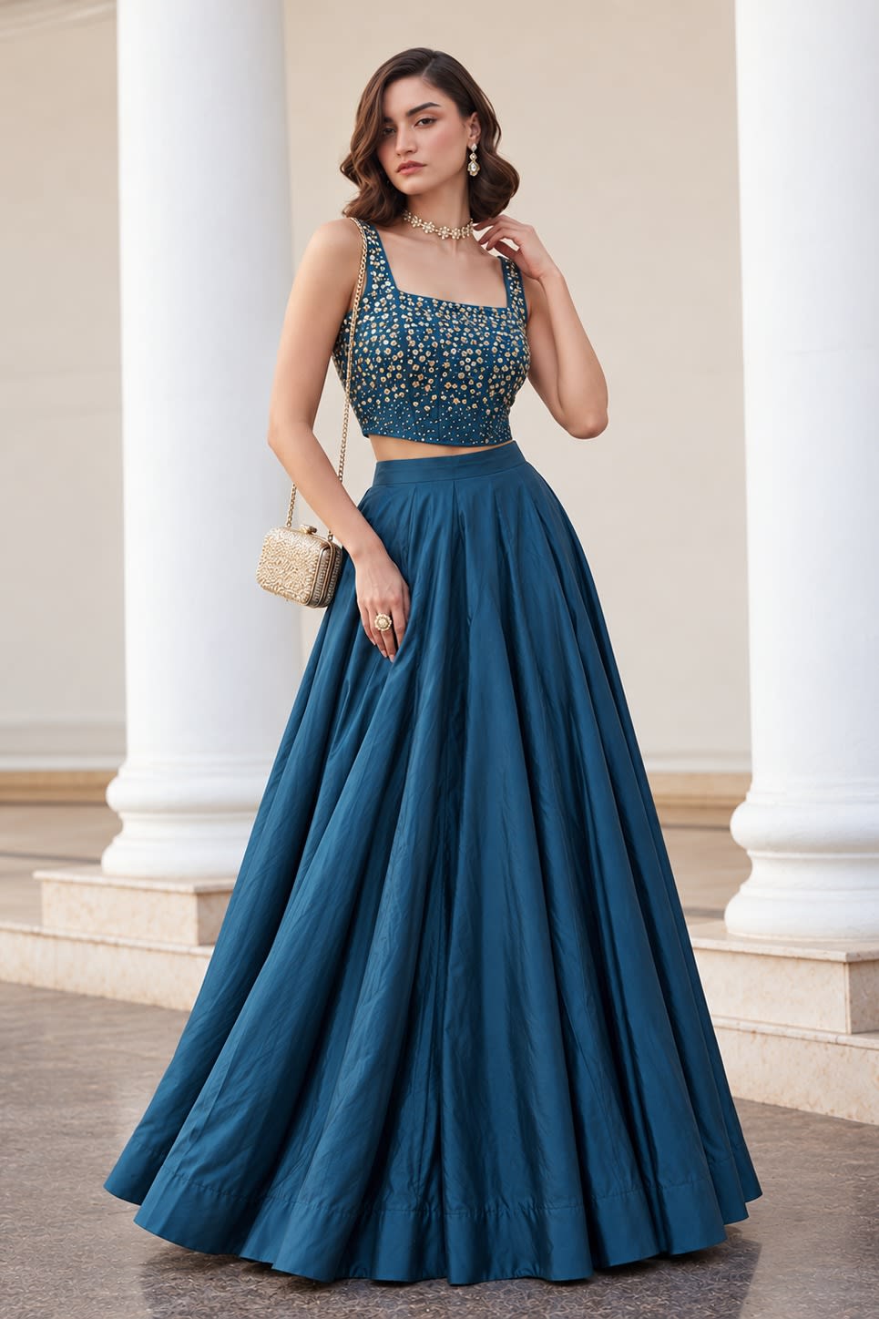 Front view of the Teal Blue lehenga choli designs, displaying the flared soft silk lehenga skirt and embroidered sleeveless choli.