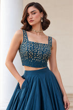 Close-up of the Teal Blue sequin lehenga, showing the sequins embroidery detailing on the soft silk choli neckline.
