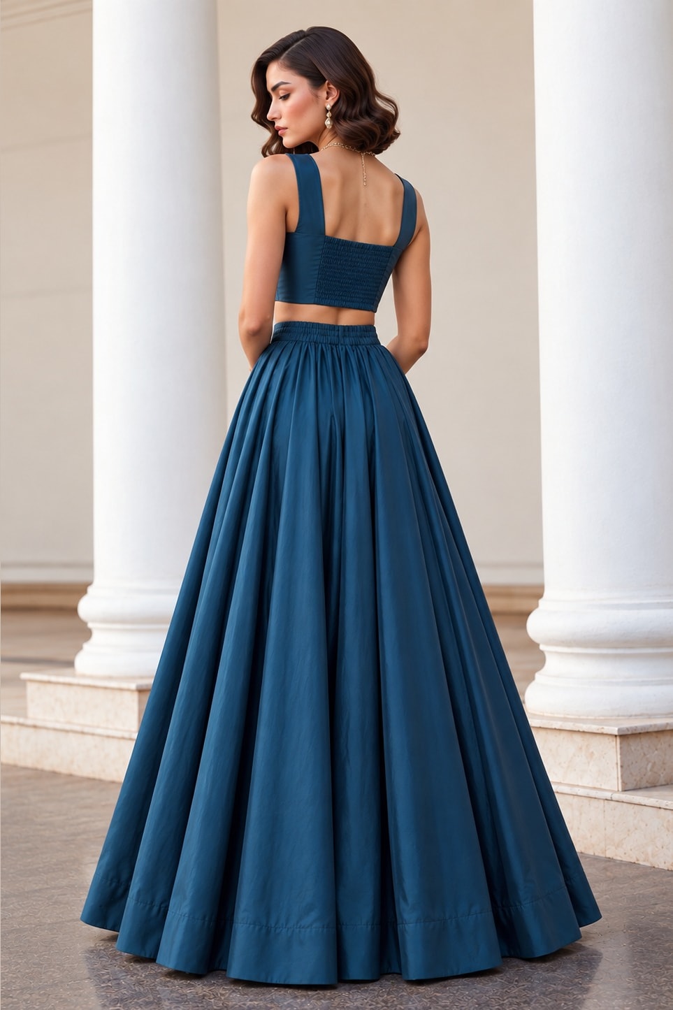 Full back view of the Teal Blue wedding lehenga, showing the square back neckline of the sleeveless choli and flowing soft silk lehenga.