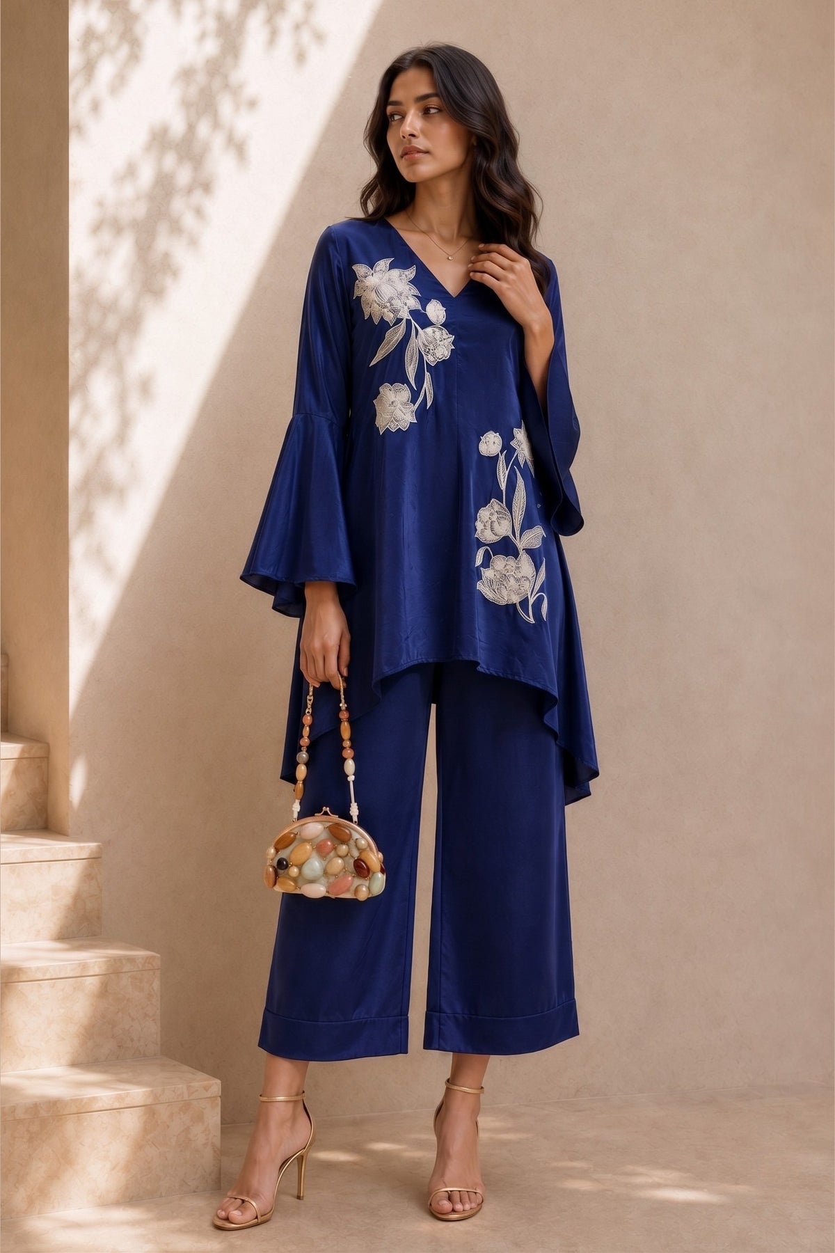 Full-length front view of a royal blue women co ord set, embroidered kurta with white floral embroidery and wide-leg pant in natural crape.