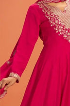 Torso detail view of a pinkish red anarkali dress in premium silk with sequin and thread embroidery on the bodice and dupatta.
