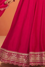 Waist-down detail view of a pinkish red anarkali dress for women in premium silk with sequin embroidered flared skirt hem.