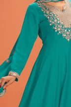Torso detail view of a teal anarkali gown in premium silk with sequin and thread embroidery on the bodice and dupatta border.