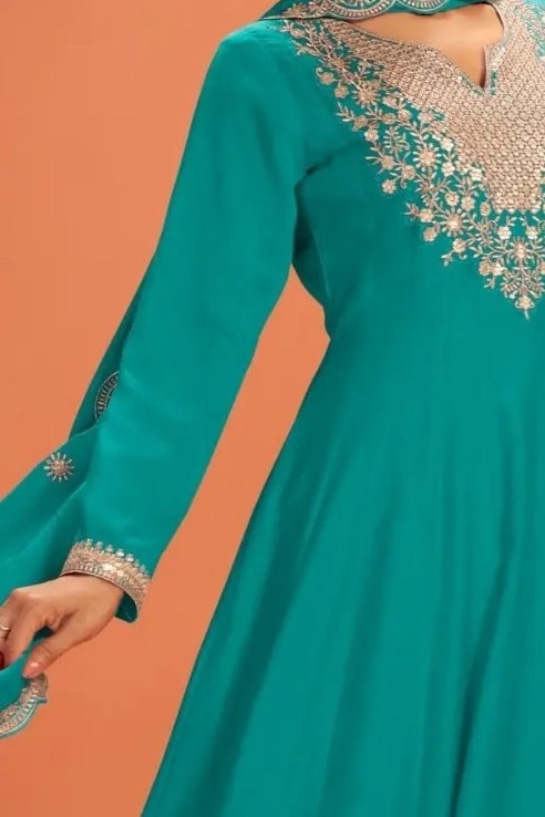 Torso detail view of a teal anarkali gown in premium silk with sequin and thread embroidery on the bodice and dupatta border.