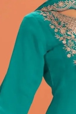 Close-up of the neckline embroidery on a teal anarkali gown for wedding outfit in premium silk with sequin and thread work.