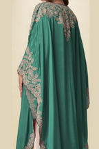 Back close-up view of a green palazzo salwar suit outfit showing detailed gold embroidery on the cape shoulders and side sleeves.