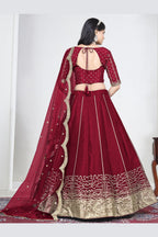 Full-length back view of a red wedding lehenga with an open back choli with dori tie and mirror work on the back. All-over mirror work.