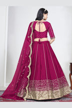 Full-length back view of a pink wedding lehenga with an open back choli with dori tie and mirror work on the back. All-over mirror work.