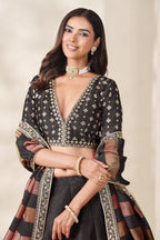 Black embroidered lehenga, close-up of the lehenga skirt embroidery and sequin work, featuring thread and sequins embroidery work on art silk with viscose dupatta.