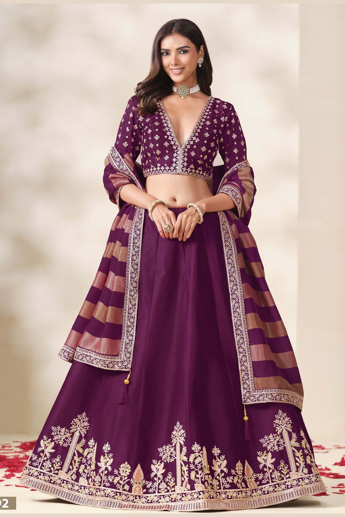 Wine Purple indian wedding lehenga, shown in a three-quarter front view, featuring thread and sequins embroidery work on art silk with viscose dupatta.