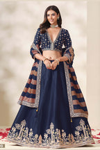 Navy Blue bridesmaid lehenga, shown in a three-quarter front view, featuring thread and sequins embroidery work on art silk with viscose dupatta.