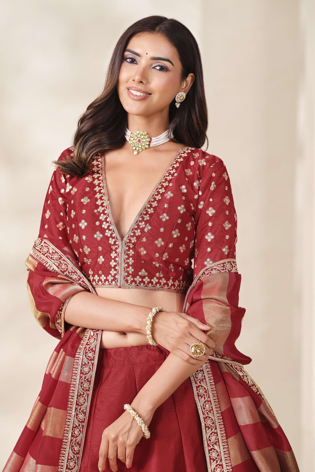 Red lehenga for sangeet, close-up of the lehenga skirt embroidery and sequin work, featuring thread and sequins embroidery work on art silk with viscose dupatta.