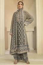 Woman wearing greenish grey indian wedding guest dresses style plazo suit in crepe silk with hand aari work and gota patti work, printed plazo and dupatta, full-length front view.