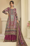 Woman wearing maroon outfits for eid style plazo suit in crepe silk with hand aari work and gota patti work, printed plazo and dupatta, full-length front view.