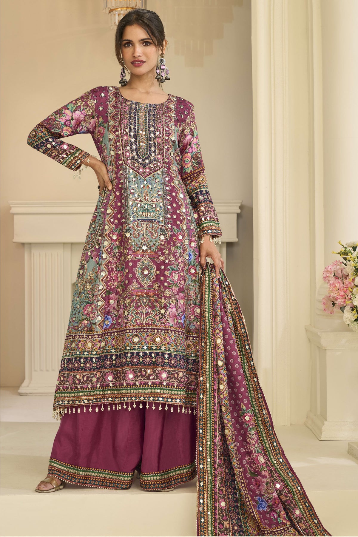 Woman wearing maroon outfits for eid style plazo suit in crepe silk with hand aari work and gota patti work, printed plazo and dupatta, full-length front view.
