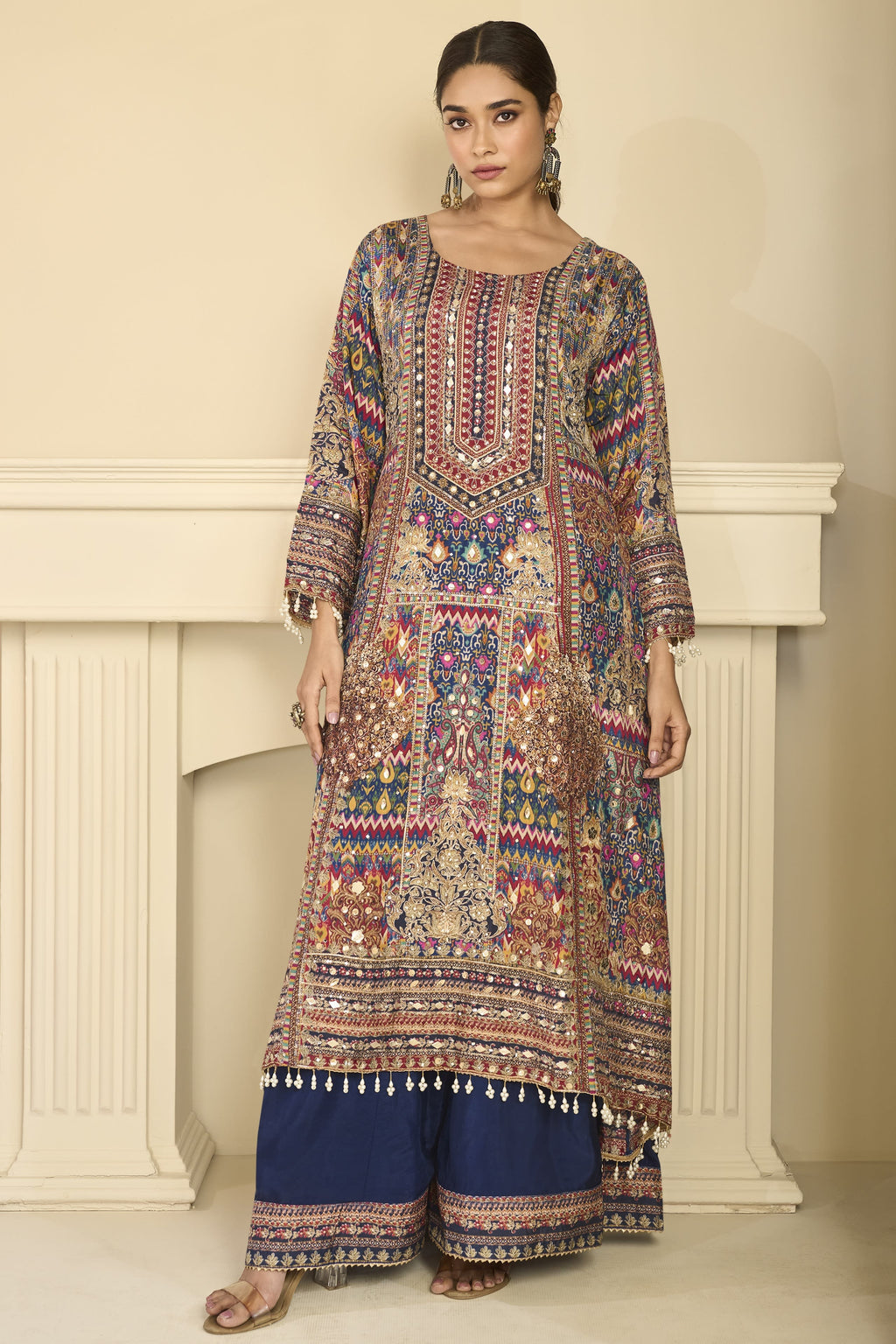 Woman wearing navy blue mehndi outfits style plazo suit in crepe silk with hand aari work and gota patti work, printed plazo and dupatta, full-length front view.