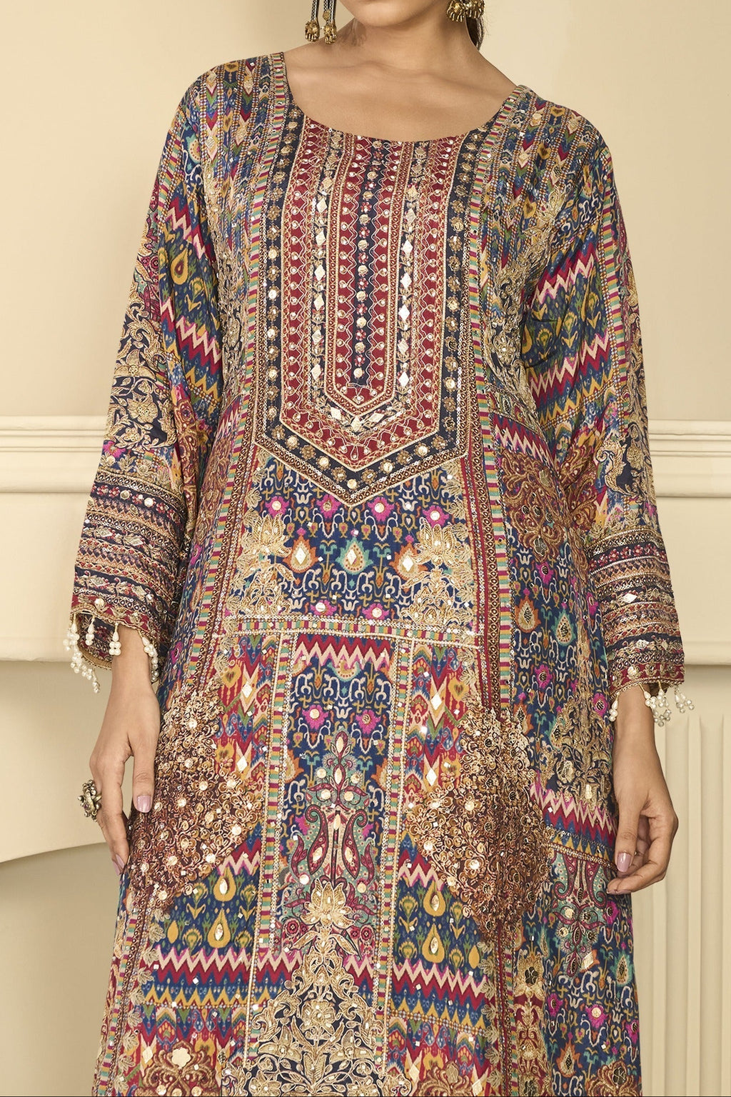 Upper-body view of navy blue mehndi outfits style plazo suit in crepe silk with hand aari work and gota patti work on the neckline and three-quarter sleeves.