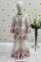 Off White kids plazo suit on mannequin, three-quarter view displaying pink thread and sequin floral embroidery.