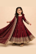 Maroon indian kidswear girls anarkali suit, full front view on model, with sequins and zari work on fendy silk.