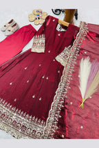 Maroon girls anarkali suit on model, side view displaying the flared anarkali silhouette with sequin work.