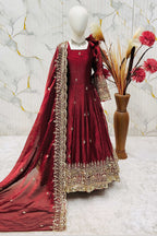 Close-up of maroon girls anarkali bodice, sequins and zari thread embroidery detail on fendy silk fabric.