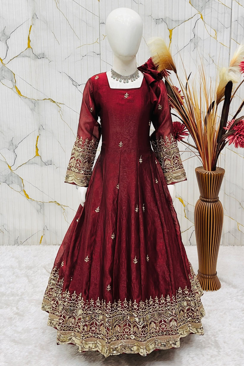 Maroon ethnic kidswear anarkali set for girls, three-quarter front view, showing zari embroidered neckline.