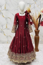 Maroon ethnic kidswear anarkali set for girls, three-quarter front view, showing zari embroidered neckline.