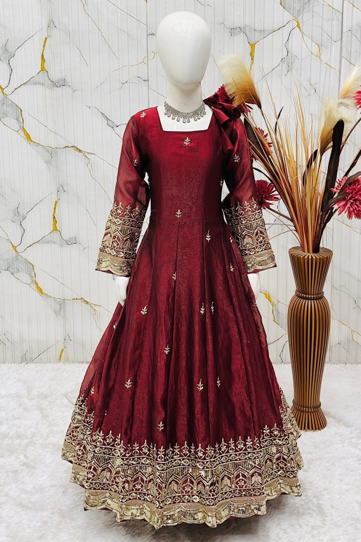 Maroon ethnic kidswear anarkali set for girls, three-quarter front view, showing zari embroidered neckline.