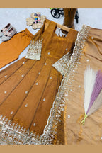 Flat lay of mustard anarkali skirt panel, sequin and zari work on fendy silk.
