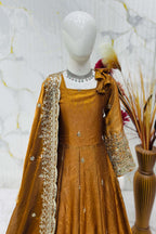 Close-up of mustard anarkali bodice, sequins and zari embroidery on fendy silk fabric.