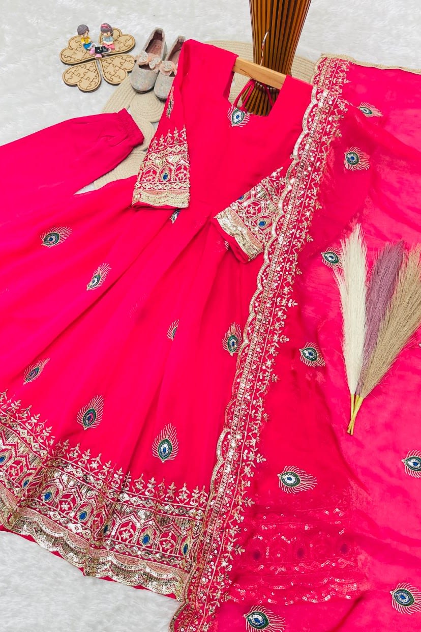 Reddish pink ethnic kidswear girls anarkali set flat lay, alternate angle showing the full embroidered three-piece set.