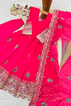 Reddish pink ethnic kidswear girls anarkali set flat lay, alternate angle showing the full embroidered three-piece set.