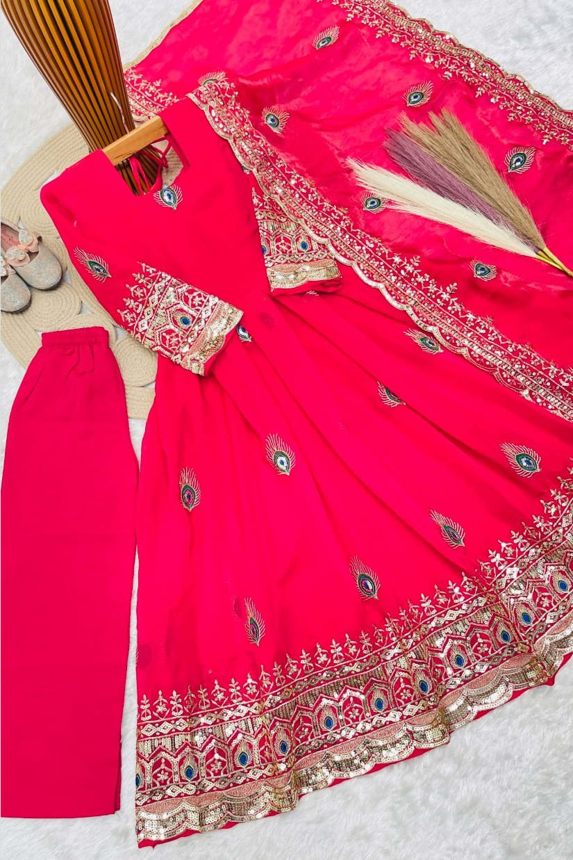 Reddish pink childrens indian outfits anarkali set flat lay with cotton pant, complete three-piece view of the outfit.