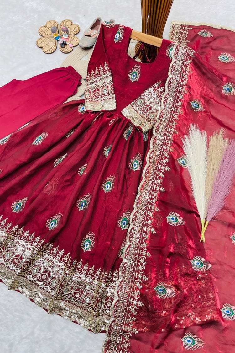 Red indian kidswear girls anarkali set flat lay, alternate angle showing the full embroidered three-piece set.