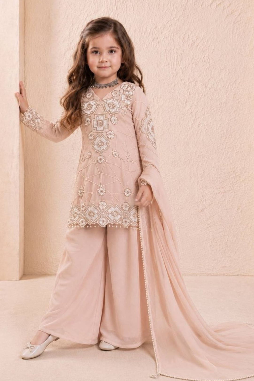 Flat lay of peach girls kurta, back side sequin and thread embroidery on georgette.