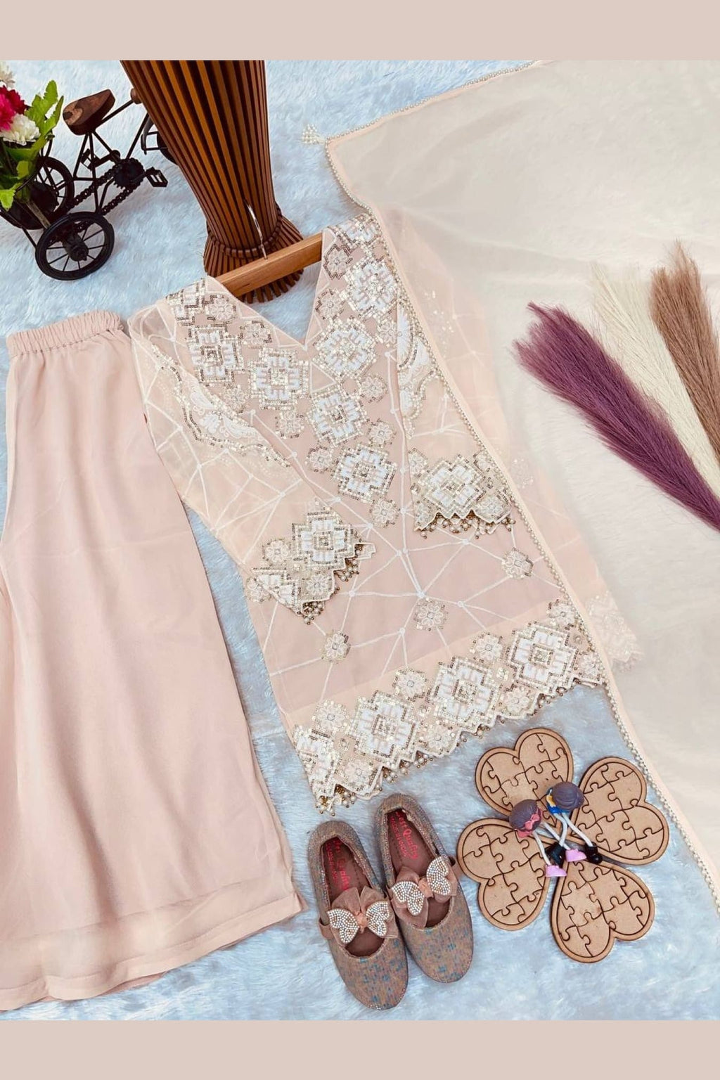 Peach childrens indian outfit kurta with palazzo, full length view with georgette dupatta.